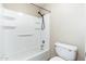 Clean, functional bathroom includes shower-tub with shelving and a standard toilet at 1217 N Miller Rd # 23, Scottsdale, AZ 85257