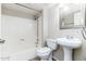 Bathroom with modern fixtures, including pedestal sink and shower-tub combination at 1217 N Miller Rd # 23, Scottsdale, AZ 85257