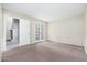 Spacious bedroom offering ample space and doors that lead out to an outdoor space at 1217 N Miller Rd # 23, Scottsdale, AZ 85257