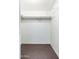 Walk-in closet with carpet, featuring built-in shelves and hanging space at 1217 N Miller Rd # 23, Scottsdale, AZ 85257