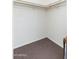 Clean walk-in closet with carpeting, white walls and shelf and rod at 1217 N Miller Rd # 23, Scottsdale, AZ 85257