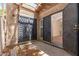 Private patio with stone surface, secure gate and view to interior living space at 1217 N Miller Rd # 23, Scottsdale, AZ 85257