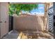 Enclosed patio with brick flooring and view of a home with mature trees at 1217 N Miller Rd # 23, Scottsdale, AZ 85257