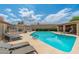 Inviting community pool area with clear blue water, lounge chairs, and shaded seating perfect for relaxation at 1217 N Miller Rd # 23, Scottsdale, AZ 85257