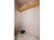 A small storage closet with one shelf and hanging rack support provides extra storage at 1217 N Miller Rd # 23, Scottsdale, AZ 85257