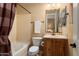 Small bathroom with bathtub, toilet, and vanity at 12976 W Plum Rd, Peoria, AZ 85383