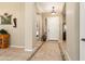 Bright and inviting foyer with tile flooring, art niche, and a clear view to the front door at 12976 W Plum Rd, Peoria, AZ 85383