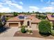 Charming single-Gathering home with lush landscaping, a three car garage, and solar panels at 12976 W Plum Rd, Peoria, AZ 85383