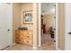 Hallway view looking into room with wood flooring and built-in bookcase at 12976 W Plum Rd, Peoria, AZ 85383