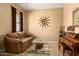 Living room featuring couch and wooden furniture at 12976 W Plum Rd, Peoria, AZ 85383
