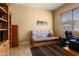 Carpeted office with futon and desk at 12976 W Plum Rd, Peoria, AZ 85383