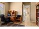 Study with desk, chair, and bookcase at 12976 W Plum Rd, Peoria, AZ 85383