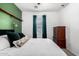 Bright bedroom showcasing natural light, a comfortable bed, and classic furniture pieces at 1322 S Owl Dr, Gilbert, AZ 85296