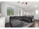 Comfortable living room with a large sectional sofa, a patterned rug, and natural light from two windows at 1322 S Owl Dr, Gilbert, AZ 85296
