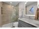 Updated bathroom features a glass-enclosed shower, modern fixtures, and sleek vanity at 13636 N Hamilton Dr # 101, Fountain Hills, AZ 85268