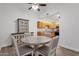 Bright dining area features modern table, chairs and cabinet, conveniently located near the well-equipped kitchen at 13636 N Hamilton Dr # 101, Fountain Hills, AZ 85268