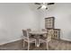 Bright dining area features modern table, chairs and cabinet on beautiful flooring at 13636 N Hamilton Dr # 101, Fountain Hills, AZ 85268