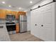 Modern kitchen with stainless steel appliances, granite countertops, and ample cabinet space at 13636 N Hamilton Dr # 101, Fountain Hills, AZ 85268