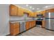 Updated kitchen with stainless steel appliances, granite countertops, and light wood cabinets at 13636 N Hamilton Dr # 101, Fountain Hills, AZ 85268