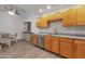 Updated kitchen with stainless steel appliances, granite countertops, and adjacent dining area at 13636 N Hamilton Dr # 101, Fountain Hills, AZ 85268
