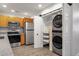 Modern kitchen with stainless steel appliances, granite countertops and laundry closet for added convenience at 13636 N Hamilton Dr # 101, Fountain Hills, AZ 85268