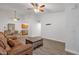 Open living space featuring a comfortable sofa, dining table, wood floors, and neutral decor at 13636 N Hamilton Dr # 101, Fountain Hills, AZ 85268