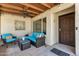 Cozy covered patio features a ceiling fan and comfortable seating, perfect for relaxing outdoors at 13636 N Hamilton Dr # 101, Fountain Hills, AZ 85268