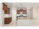 Open kitchen with stainless steel appliances, granite countertops and white tile backsplash at 14355 W Valentine St, Surprise, AZ 85379