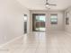 Living space filled with light and a ceiling fan overlooking backyard at 14355 W Valentine St, Surprise, AZ 85379