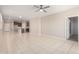 Open floor plan featuring tile flooring, modern ceiling fan and neutral paint at 14355 W Valentine St, Surprise, AZ 85379