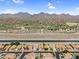 Stunning aerial view featuring a golf course, desert landscape, and a canal at 14393 N 101St St, Scottsdale, AZ 85260
