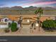Beautiful home with a tile roof in a landscaped community with mountain views and desert surroundings at 14393 N 101St St, Scottsdale, AZ 85260