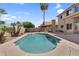 Backyard showcasing pool, desert landscaping, and serene privacy walls at 14393 N 101St St, Scottsdale, AZ 85260