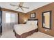 Comfortable bedroom featuring natural light, neutral decor, and warm accents at 14393 N 101St St, Scottsdale, AZ 85260