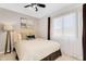 Serene bedroom featuring a comfortable bed, natural light, and neutral decor at 14393 N 101St St, Scottsdale, AZ 85260