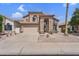 Stunning two-story home featuring a well-manicured desert landscaped front yard and private two-car garage at 14393 N 101St St, Scottsdale, AZ 85260