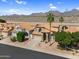 Charming single-Gathering home featuring desert landscaping, mountain views, and a tile roof at 14393 N 101St St, Scottsdale, AZ 85260