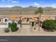 Exterior elevation of a desert home featuring a private desert yard with mature landscaping at 14393 N 101St St, Scottsdale, AZ 85260