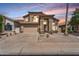 Charming two-story home featuring stucco siding, a two-car garage, desert landscaping, and a tiled roof at 14393 N 101St St, Scottsdale, AZ 85260