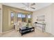 Cozy living room with bay window offering natural light and scenic views at 14393 N 101St St, Scottsdale, AZ 85260