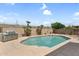 Backyard featuring a stainless steel BBQ, refreshing pool, and desert landscaping at 14393 N 101St St, Scottsdale, AZ 85260