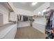 Walk in closet with carpet floors, white walls and built in shelving at 16229 W Berkeley Rd, Goodyear, AZ 85395