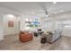 The living room has recessed lighting, wood-look flooring, built-in shelving, and comfortable seating at 16229 W Berkeley Rd, Goodyear, AZ 85395