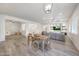 Spacious open-concept layout with living room, dining area, and modern decor for flexible living at 16229 W Berkeley Rd, Goodyear, AZ 85395