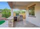 Outdoor kitchen with built-in grill and counter space for entertaining at 16229 W Berkeley Rd, Goodyear, AZ 85395