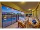 Inviting outdoor living space with comfortable seating, pool view, and covered patio at 16229 W Berkeley Rd, Goodyear, AZ 85395