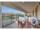 Inviting outdoor living space with comfortable seating, pool view, and covered patio at 16229 W Berkeley Rd, Goodyear, AZ 85395