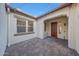 Cozy outdoor patio featuring brick pavers and exterior lighting at 16229 W Berkeley Rd, Goodyear, AZ 85395