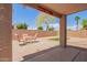 Inviting backyard with a seating area under 'Karen's Korner' sign, showcasing space for relaxation and outdoor enjoyment at 16274 N 138Th Ln, Surprise, AZ 85374