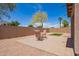 Relaxing backyard patio with charming furniture and brick pavers, ideal for outdoor entertaining and leisure at 16274 N 138Th Ln, Surprise, AZ 85374
